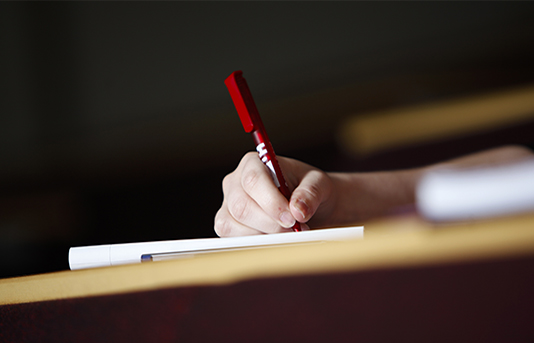 Pen and notebook on a desk